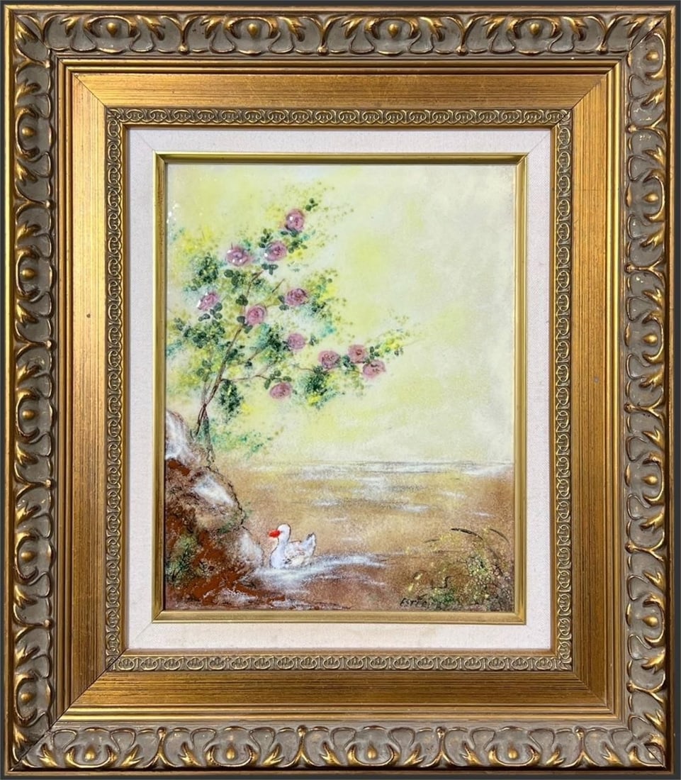 Framed Enamel Landscape with Ducks & Blossoms: Delicately rendered pastel colored enamel on copper landscape depicting a tranquil waterside scene with a white duck resting at the edge of a stream beneath flowering branches, executed in soft, atmos