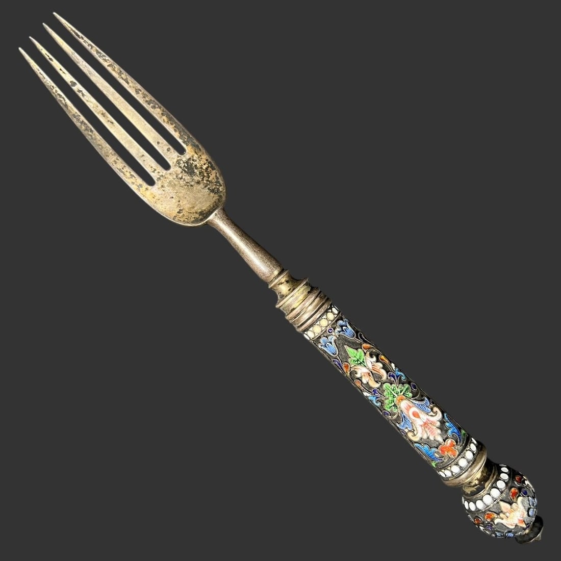 Russian 84 Silver Cloisonne Enamel Floral Fork: This finely crafted Russian silver fork features a richly decorated cloisonné enamel handle accented with vibrant floral and foliate motifs in blue, green, white, and orange, framed by dotted enamel