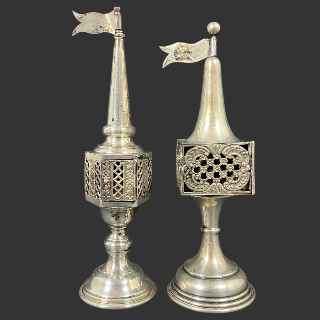 Pair of Antique Sterling Silver Spice Towers: This elegant pair of antique sterling silver spice towers is beautifully crafted in a tall baluster form with hexagonal pierced chambers designed to hold aromatic spices, each fitted with hinged latti