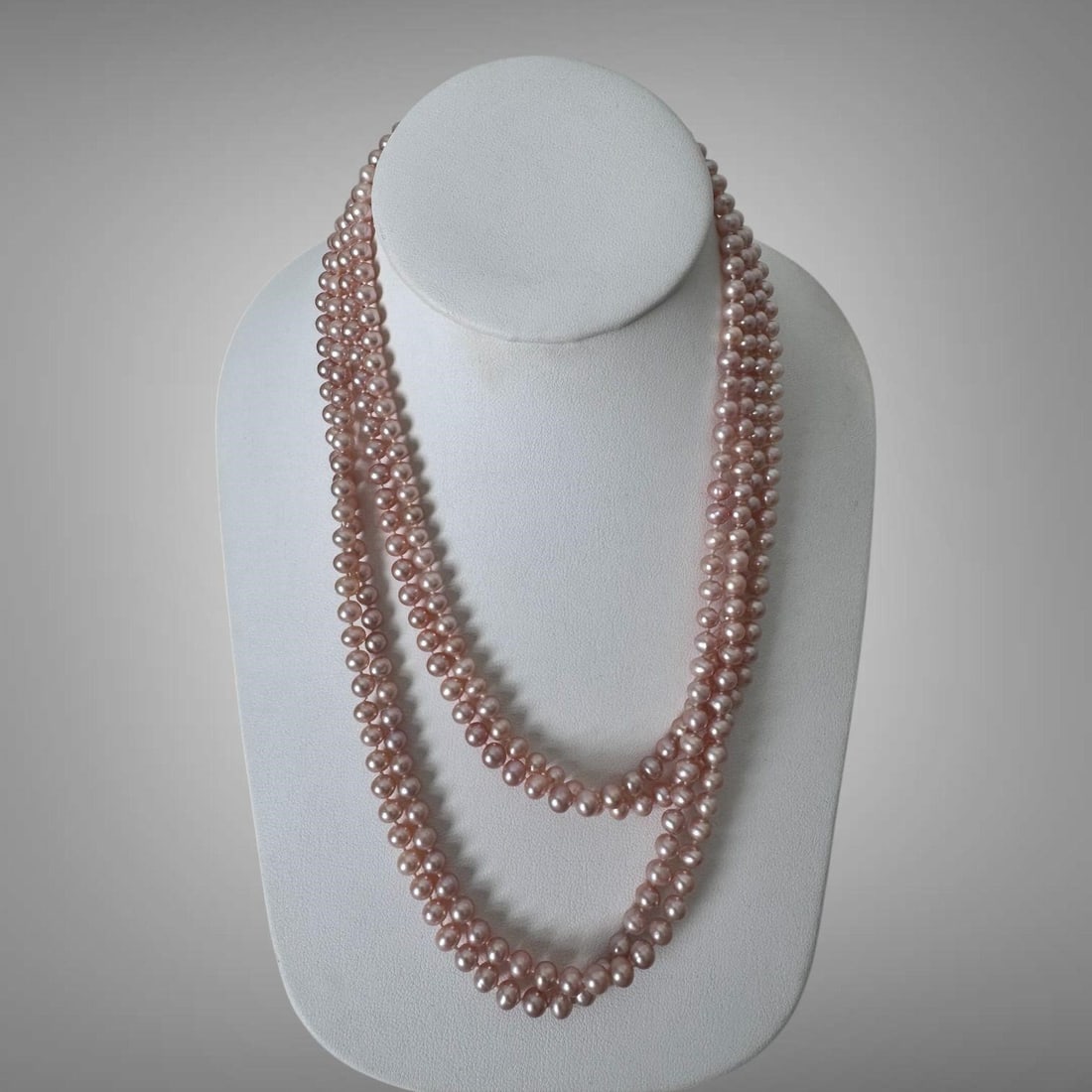 Vintage 14K Gold Single-Strand Pearl Necklace 73": The necklace features a natural color freshwater cultured pearls with pink to peach hue. 14K mark on the clasp. Approx. dimensions (in): 73" long, each pearl measures approximately 1/8".