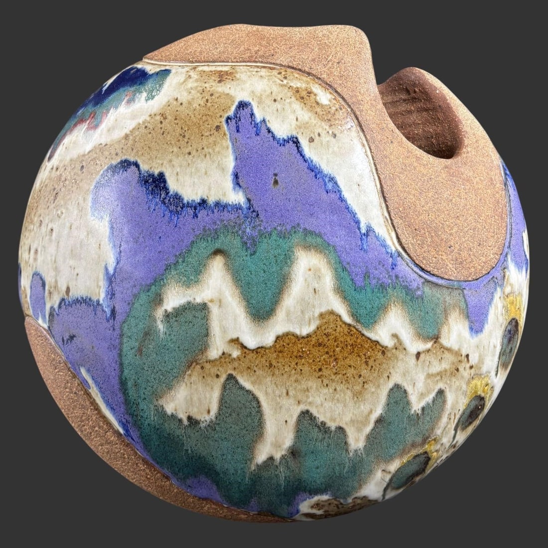 Ken Pick Studio Art Pottery Sculptural Vessel: Studio art pottery sculptural vessel by Ken Pick, featuring an organic, hand-built form with a rounded body raised on three integral legs and a sculpted opening at the top. The piece is finished in a