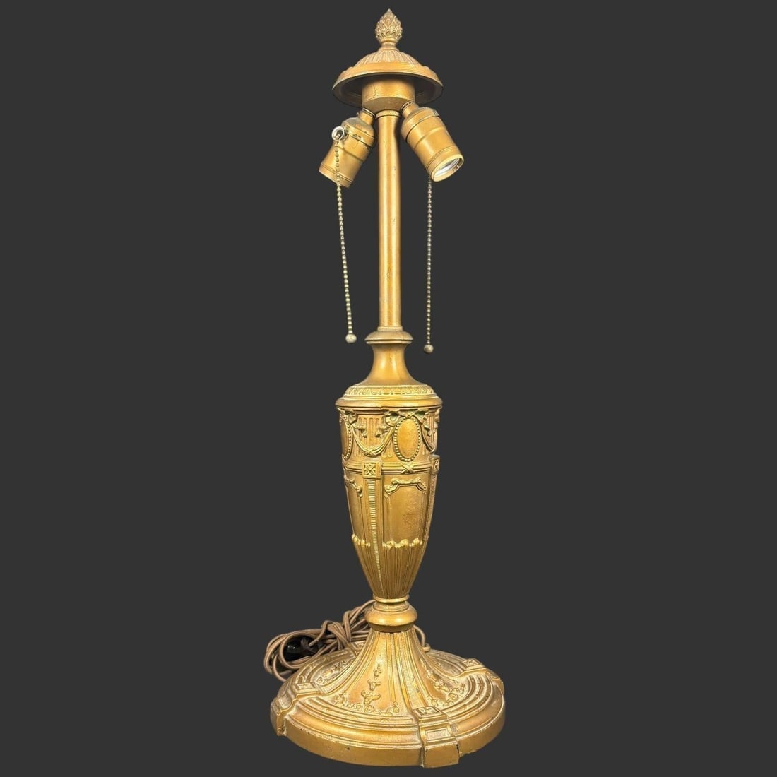 Antique Gilt Metal Three-Light Table Lamp: Antique gilt metal three-light table lamp featuring an ornate neoclassical design with a fluted columnar stem rising from a heavily cast and decorated base adorned with garlands, medallions, and class
