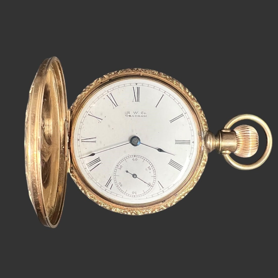 H. W. Co. Waltham Pocket Watch with Portrait Case: Antique American pocket watch by H. W. Co. Waltham, featuring a gilt mechanical movement signed "American Waltham Watch Co., Waltham, Mass." with visible serial number 4056092, dating the mo