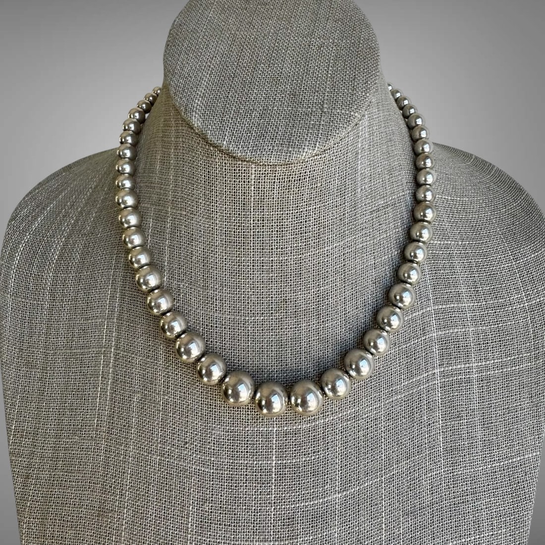 Vintage Tiffany & Co. Sterling Silver Ball Necklace: Vintage Tiffay & Co. graduated bead necklace mad of sterling silver. Stamped with Tiffany & Co. and 925. Lobster clasp. Length is 16". beads range in size from 5 to 8mm. Weight: 17.56dwt.