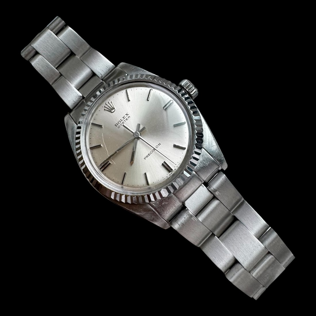Vintage Mens Rolex Oyster Precision Wristwatch: Classic vintage Rolex Oyster Precision in stainless steel, featuring a timeless silver dial and iconic fluted bezel. This piece embodies understated Rolex elegance with its clean stick indices, s