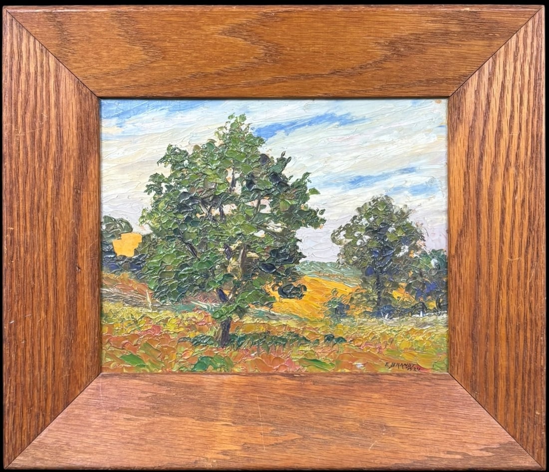 E. Brandt Dated 1924 Framed Impasto Landscape Oil Painting: A vibrant 1924 impasto oil painting by E. Brandt, signed and dated at the lower right, depicting a lively rural landscape with a winding country lane, clustered trees, golden fields, and a breezy blue