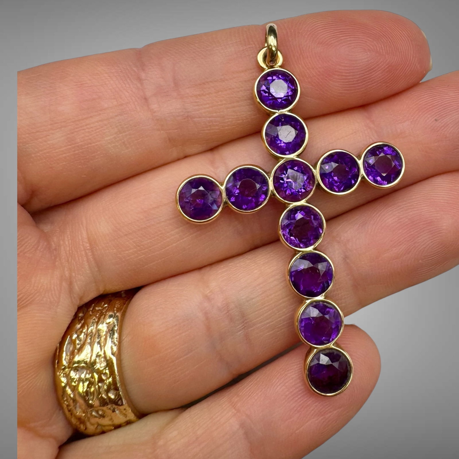 Large 14K Gold Amethyst Cross Pendant: Elegant and eye-catching vintage cross pendant crafted in solid 14K yellow gold, set with vibrant round-cut amethysts in smooth bezel settings. The rich purple gemstones contrast beautifully against t