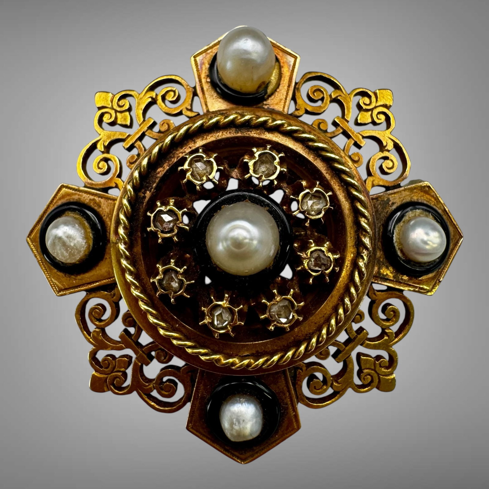 Antique 14K Gold Seed Pearl & Rose Cut Diamond Brooch: Elegant antique 14K yellow gold brooch featuring an ornate openwork design accented with luminous natural seed pearls and rose cut diamonds. The circular center is framed by twisted rope detailing wit