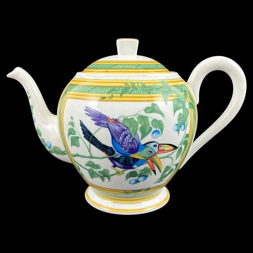 Hermès Paris France Toucans Porcelain Teapot with Lid: Elegant Hermès porcelain teapot in the desirable “Toucans” pattern, featuring colorful tropical toucan decoration with green vine accents and yellow geometric borders on a glossy wh