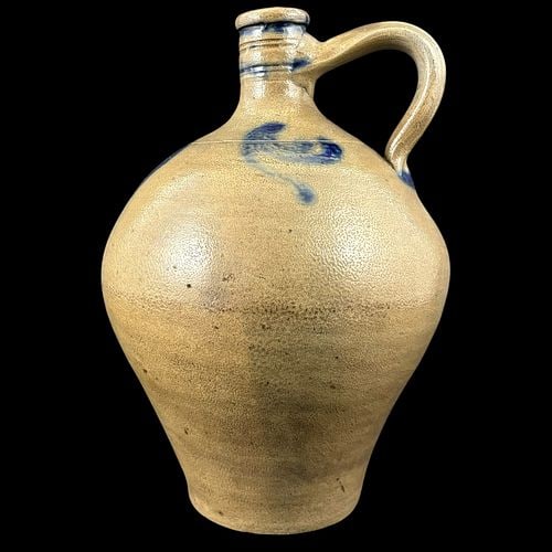 Antique Salt Glazed Stoneware Cobalt Decorated Ovoid Jug: Antique salt-glazed stoneware handled jug featuring a rounded ovoid body, narrow mouth, applied loop handle, and cobalt blue brushed decoration around the shoulder and neck. The exterior has a warm ta