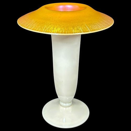 Steuben Aurene on Calcite Iridescent Art Glass Trumpet Vase: Elegant art glass trumpet vase with a tall milky white opaline-style body, circular foot, and wide flared rim finished in a vibrant golden-orange iridescent surface with pink and yellow highlights. Th