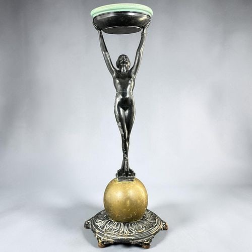 Frankart Art Deco Figural Nude Woman Pedestal Floor Ashtray: Art Deco-style decorative pedestal featuring a stylized black-finished nude female figure standing atop a gold-tone sphere with her arms raised to support a shallow turquoise-glazed ceramic dish. The 