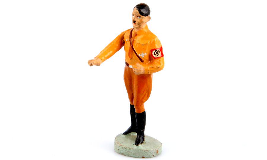 1 A. Hitler, Elastolin, manufactured around 1938: 1 Hitler stehend im Hemd, beweglicher Grußarm, Elastolin (ungemarkt), 7,5 cm-Größe, originale Bemalung, leicht berieben, minimale Risse, K2, Massefigur, passend zu Figuren von Lineol, E