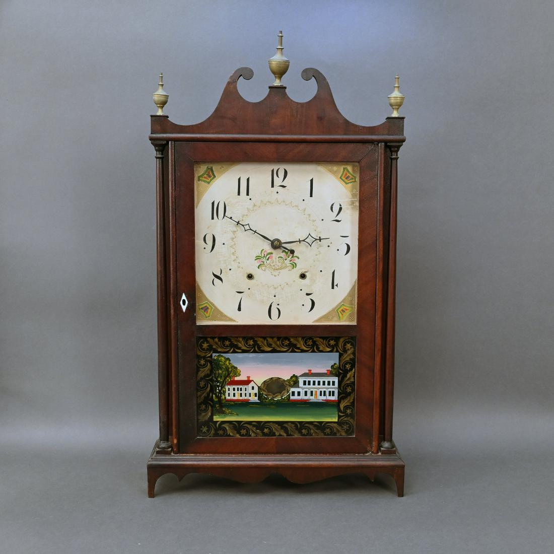 Connecticut Federal Mahogany Pillar & Scroll Clock: Federal Mahogany Pillar And Scroll Clock, Seth Thomas, Plymouth, Connecticut. The Broken Arch Pediment With Brass Finials Above A Rectangular Door With Eglomise Panel, Flanked By Tapering Columns, Ope