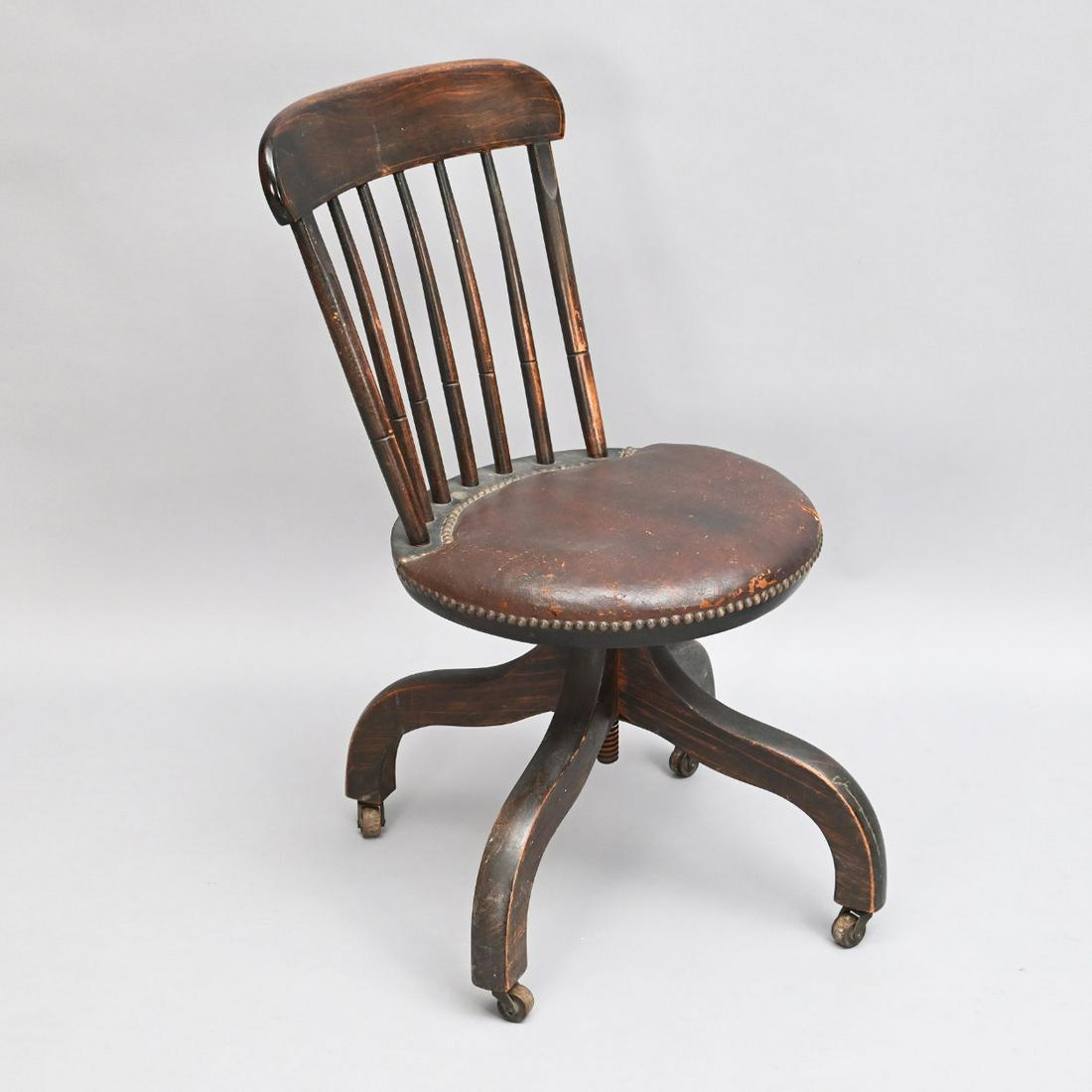 Boston Grain Painted Windsor Desk Chair: 18th/19th Century Boston Grain Painted Leather Upholstered Windsor Pivoting Desk Chair. The Arched Crest Rail Above A Seven Spindle Back, Over A Leather Upholstered Round Seat, Raised On Spider Legs. 