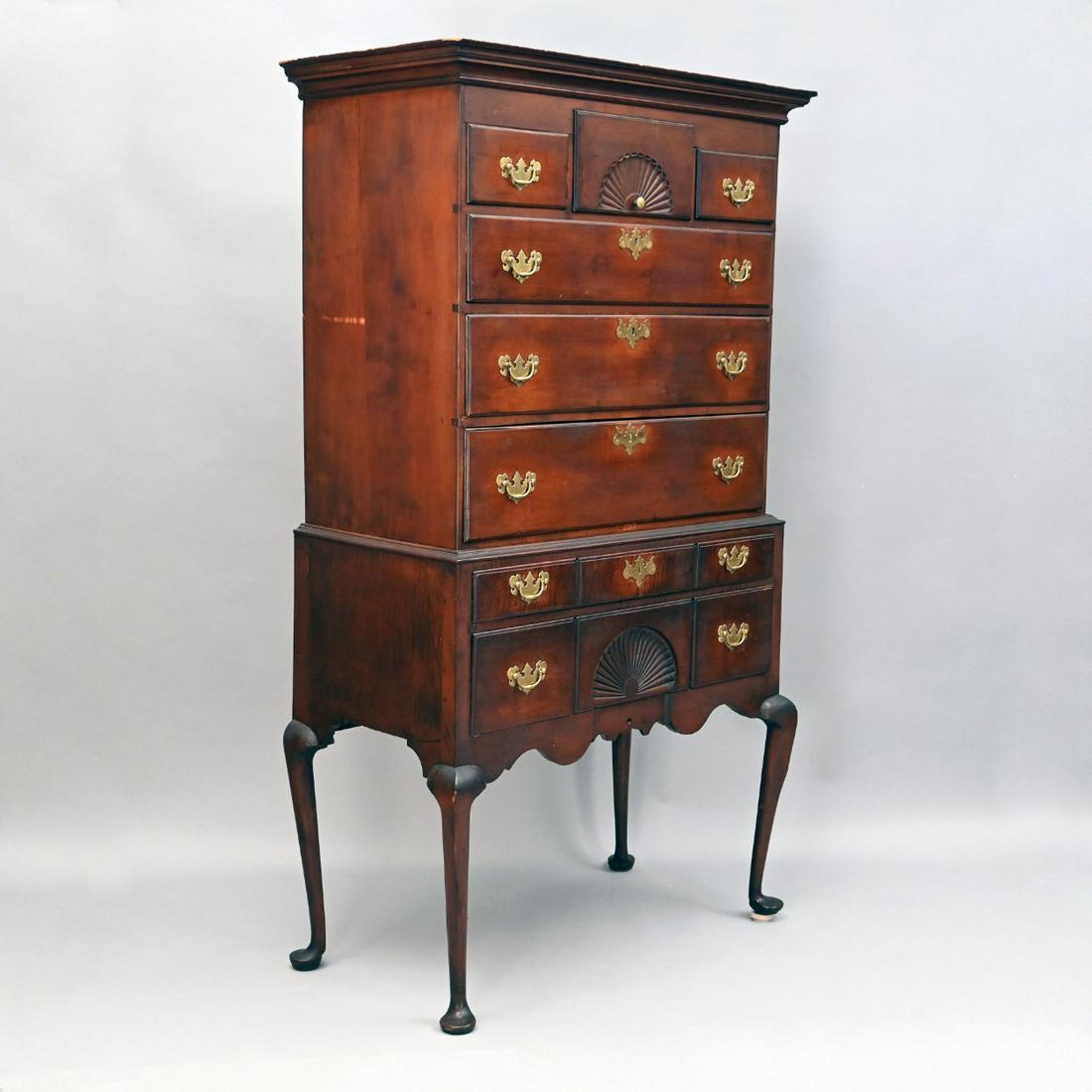 New England Queen Anne Maple Highboy: New England Queen Anne Fan Carved Maple Highboy. In Two Parts; The Upper Section With Central Fan Carved Short Drawer Flanked By Stepped Short Drawers Over Three Graduated Long Drawers; The Lower Sect