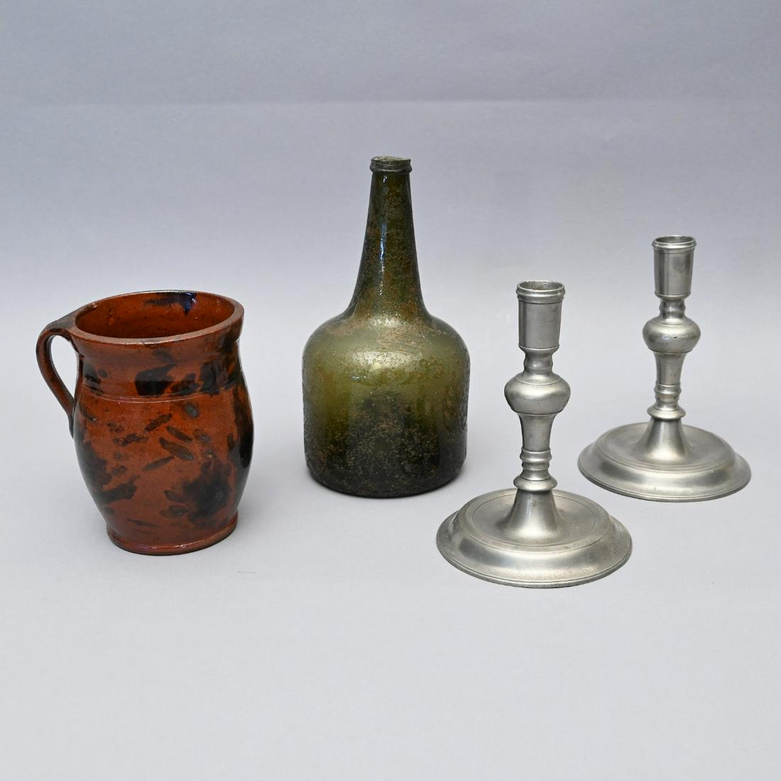 Redware Pot, Squat Bottle And Pewter Candlesticks: Pennsylvania Redware Manganese Decorated Honey Pot, Together with an Olive Glass Squat Cylinder Wine Bottle and a Pair of Pewter Candlesticks. Heights (in Order) 5 3/4 Inches; 9 1/4 Inches & 7 Inches.