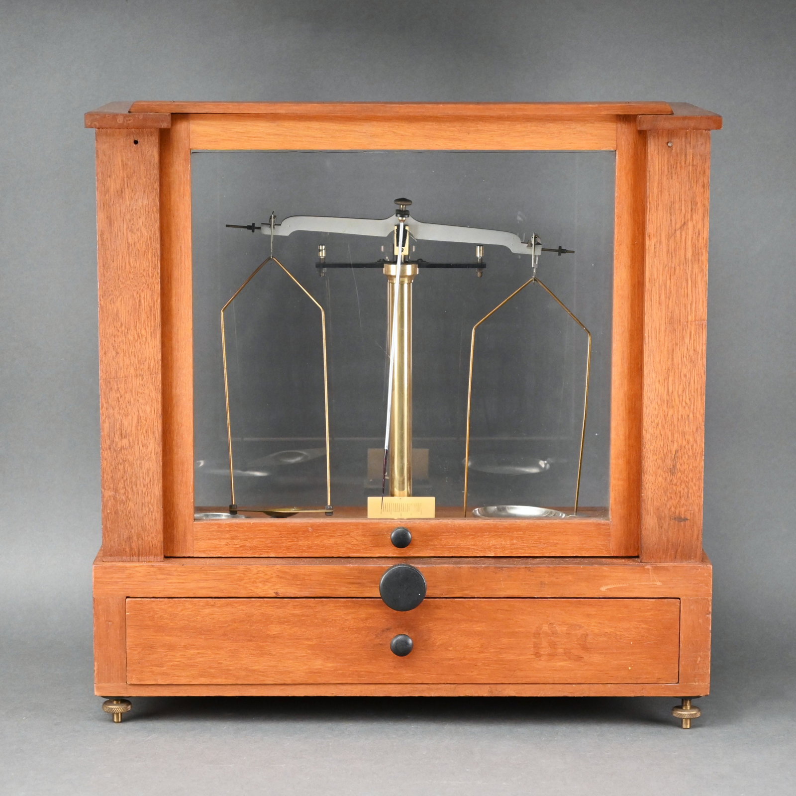 Voland & Sons, New Rochelle, NY Scientific Balance: Mahogany case with cased set of weights and tweezers. H: 16.25 in., W: 16 in., D: 7.5 in.