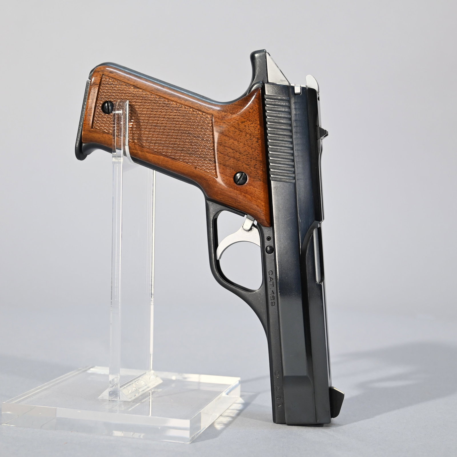Benelli Model B80 Pistol: Double-action semiautomatic pistol chambered in 7.65 mm parabellum; #02329C; checkered walnut grips; includes one magazine. Barrel length: 4 inches. Overall length: 7.875 inches.