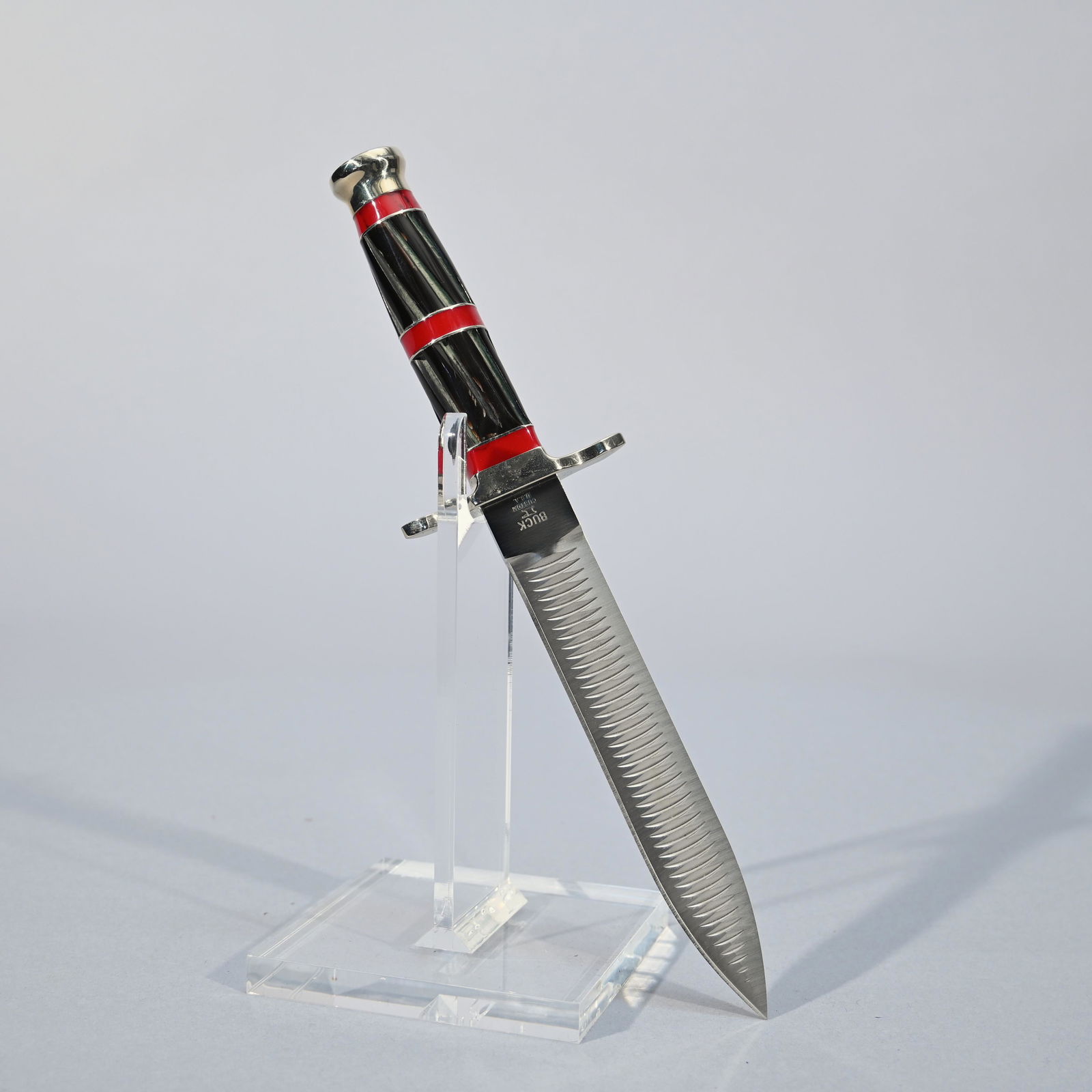 Cased Buck 976LE Heritage File Dagger: Limited custom shop edition #159/250. Black buffalo horn grip with bloody jasper inlay. Includes fitted glass-top presentation box. Blade length: 6.625 inches. Overall length: 11.125 inches.