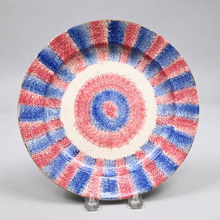 Staffordshire Bulls-Eye Rainbow Spatterware Plate: Staffordshire Bulls-Eye Two-Color Rainbow Spatterware Plate, Circa 1830. Sponged with a red and blue bull's-eye in the center, and with repeating red and blue stripes around the rim. H: 1.25 in., W: