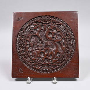 American Carved Walnut Cakeboard, Conger & Watkins: John Conger (ca. 1803-1869) and James W. Watkins (1807-1883), New York, New York, Nineteenth Century. Carved with a view of a gentleman astride his horse and waving a kerchief, surrounded by flower