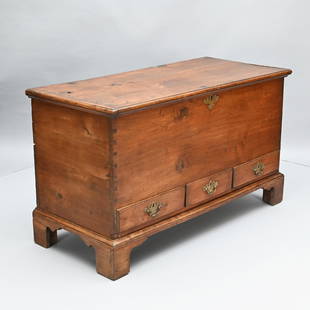 Pennsylvania Chippendale Walnut Blanket Chest: The oblong hinged top with applied molded edge, opening to a well with til, above three split drawers raised on a molded bracket base. H: 28.5 in.; W: 49 in.; D: 21.5 in.
