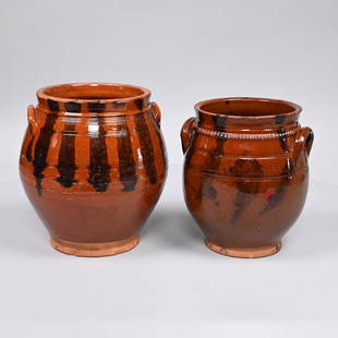 Two American Redware Manganese-Decorated Jars: Both likely of Long Island, New York or Connecticut origin, Nineteenth Century. Each of ovoid form with applied handles, the first with incised banding along the shoulder and mid-section with