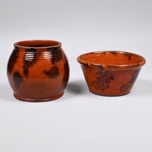 Two American Redware Manganese-Decorated Vessels: Comprising a New England jar of bulbous form, the short collar above a shoulder tooled with incised rings, decorated with various manganese stripes and splotches; the second, a Pennsylvania flared