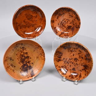 Four Redware Manganese-Decorated Bowls: Likely Pennsylvania, Nineteenth Century. Each shallow bowl daubed on the interior in manganese brown. H: 1.5 in., Diam.: 7.375 in. (largest) H 1.625 in. Diam.: 6.375 in. (smallest)
