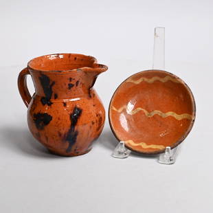 American Glazed Redware Pitcher and Plate, C. 1840: The first probably Bristol County, Massachusetts or Norwalk, Connecticut, medium red clay covered in speckled orange-brown glaze daubed in manganese brown; the miniature dish probably Norwalk,