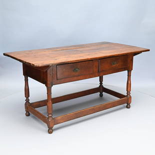 Pennsylvania Walnut Pin-Top Tavern Table: The oblong top with battens pinned to a conforming base with two short drawers, raised on block-turned legs, joined by a box stretcher. H: 30.5 in.; W: 60.5 in.; D: 33 in.