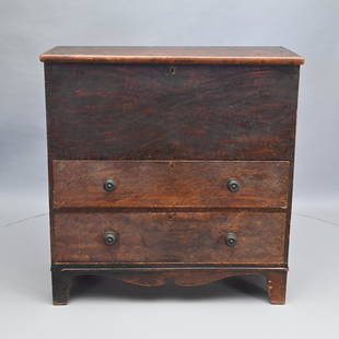 New England Chippendale Painted Pine Blanket Chest: The oblong top with applied edge and wrought-iron strap hinges opening to a well above two graduated drawers, both fitted with original turned and threaded maple knobs, over a shaped skirt, raised on