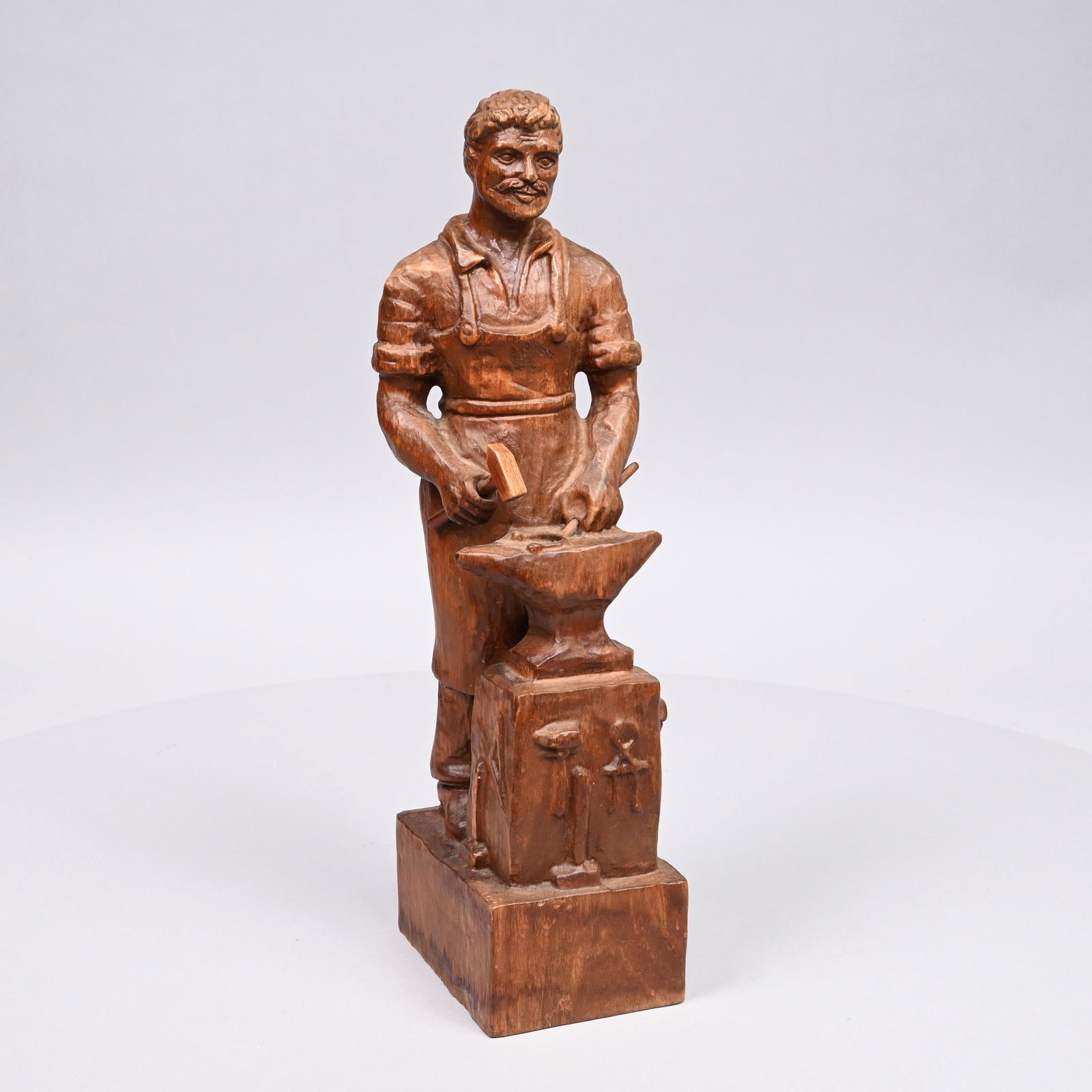 Folk Art Carved Wooden Sculpture of a Blacksmith (1 of 5)