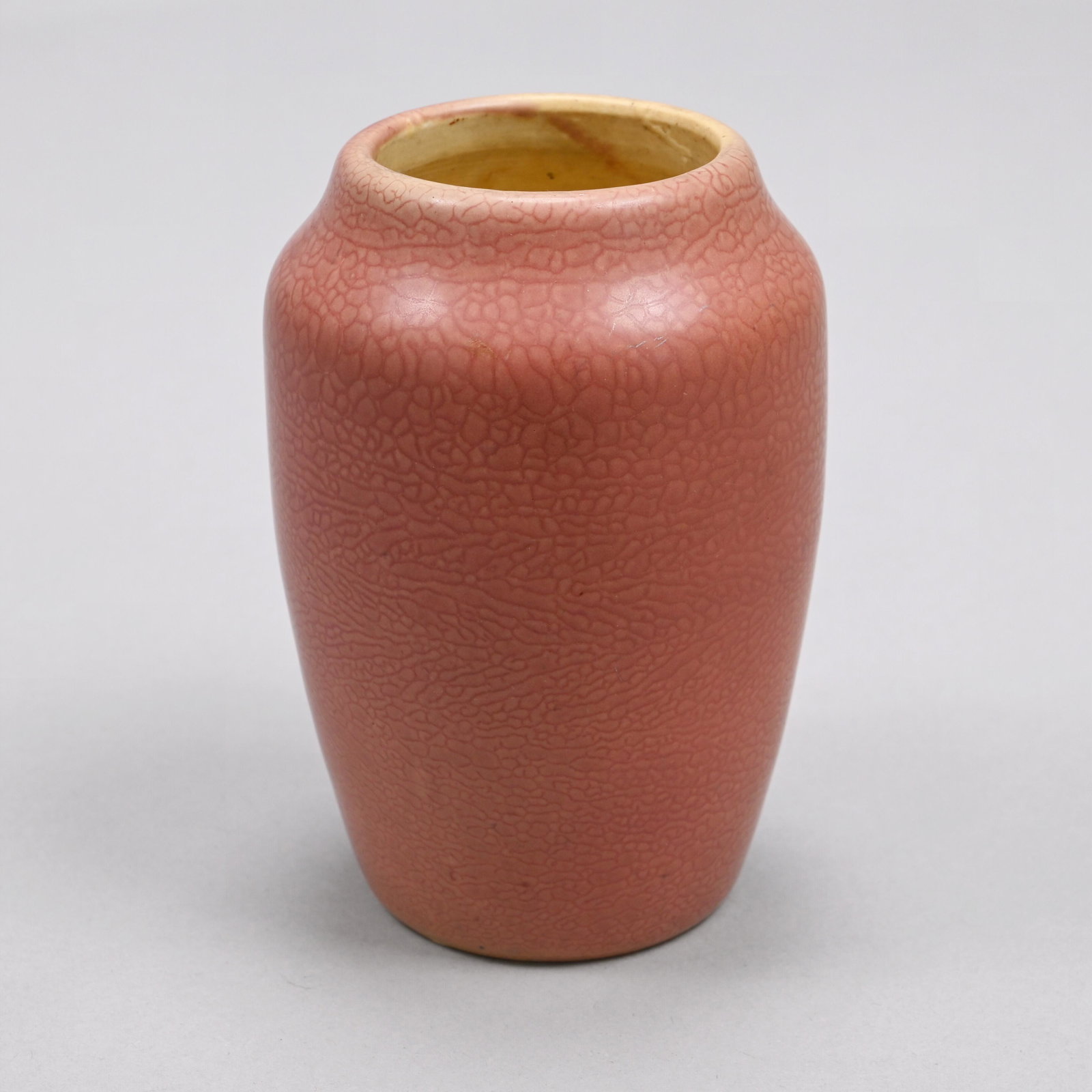 Hampshire Pottery Vase, Cadmon Robertson, 1904-14: Designed by Cadmon Robertson, Keene, New Hampshire, 1904-14. Of tapered cylindrical form, covered in matte rose glaze, incised "Hampshire Pottery," letters "M" and "O" (M within a circle) for Emoretta