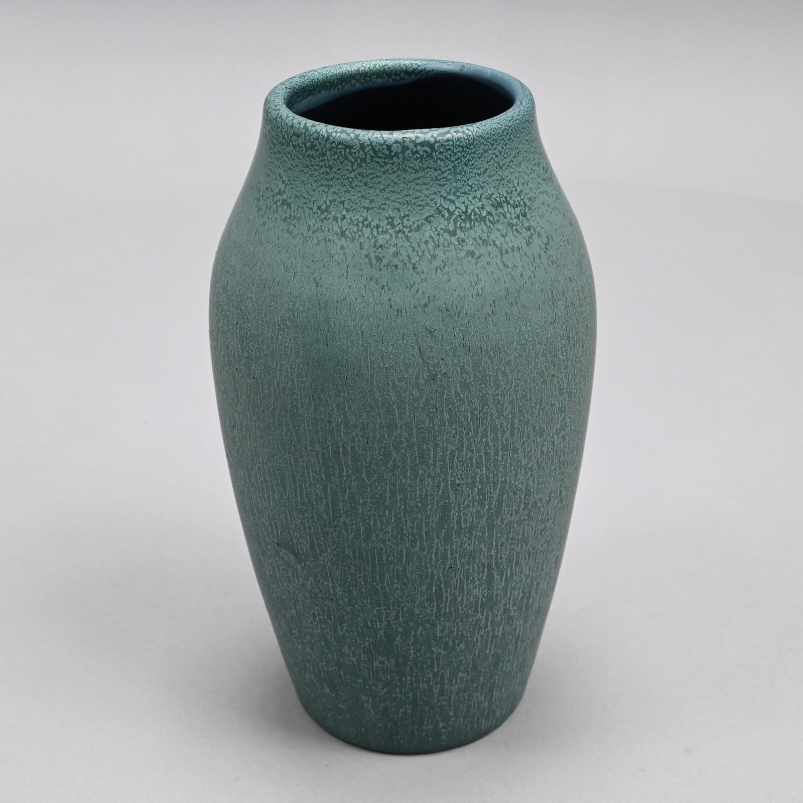 Hampshire Pottery Vase, Cadmon Robertson, 1904-14: Designed by Cadmon Robertson, Keene, New Hampshire, 1904-14. Of ovoid tapered form, covered in finely streaked matte blue glaze, incised "Hampshire Pottery," letters "M" and "O" (M within a circle) fo