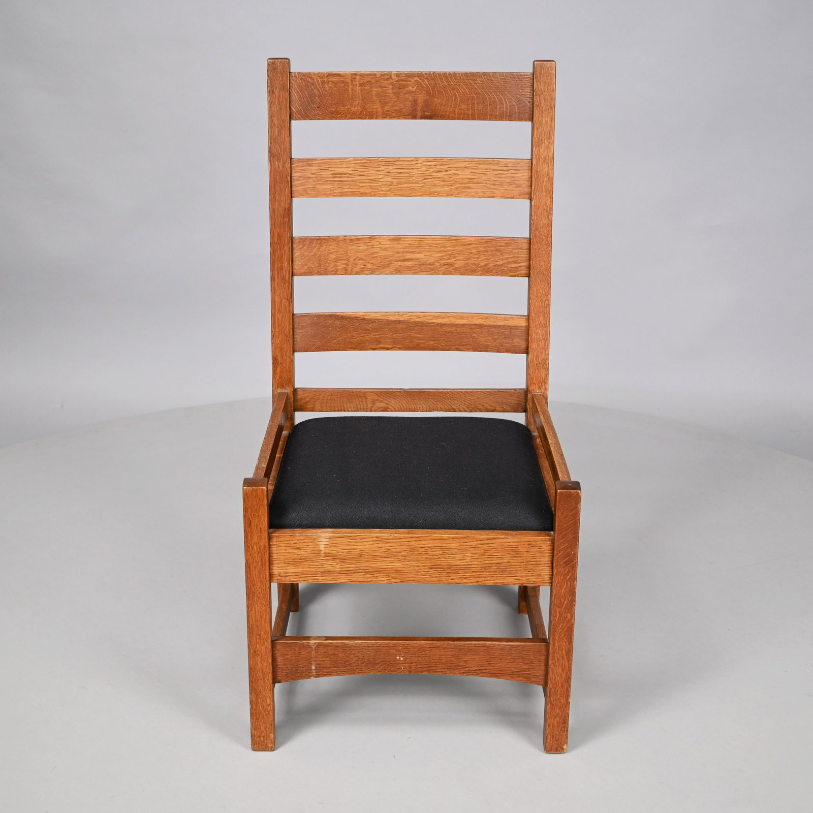 Arts & Crafts Oak #304 Chair, Gustav Stickley Co.: Syracuse, New York, 1912-16. The four horizontal curved splats above a slip-seat within side and back rails and a conforming apron, raised on four square legs joined by arched front and back stretcher