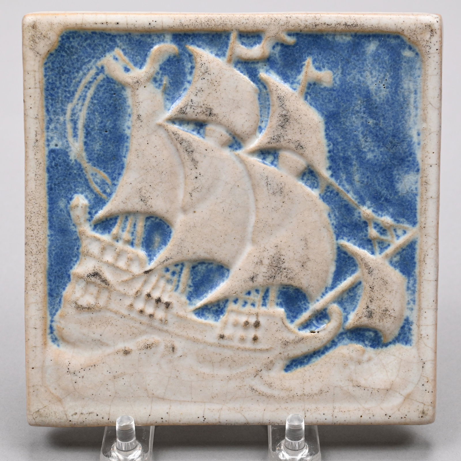Marblehead Pottery Blue & White Galleon Ship Tile: Marblehead, Massachusetts, 1910s. Impressed "MP" ship mark. H: 4.875 in., W: 4.875 in., D: .375 in.
