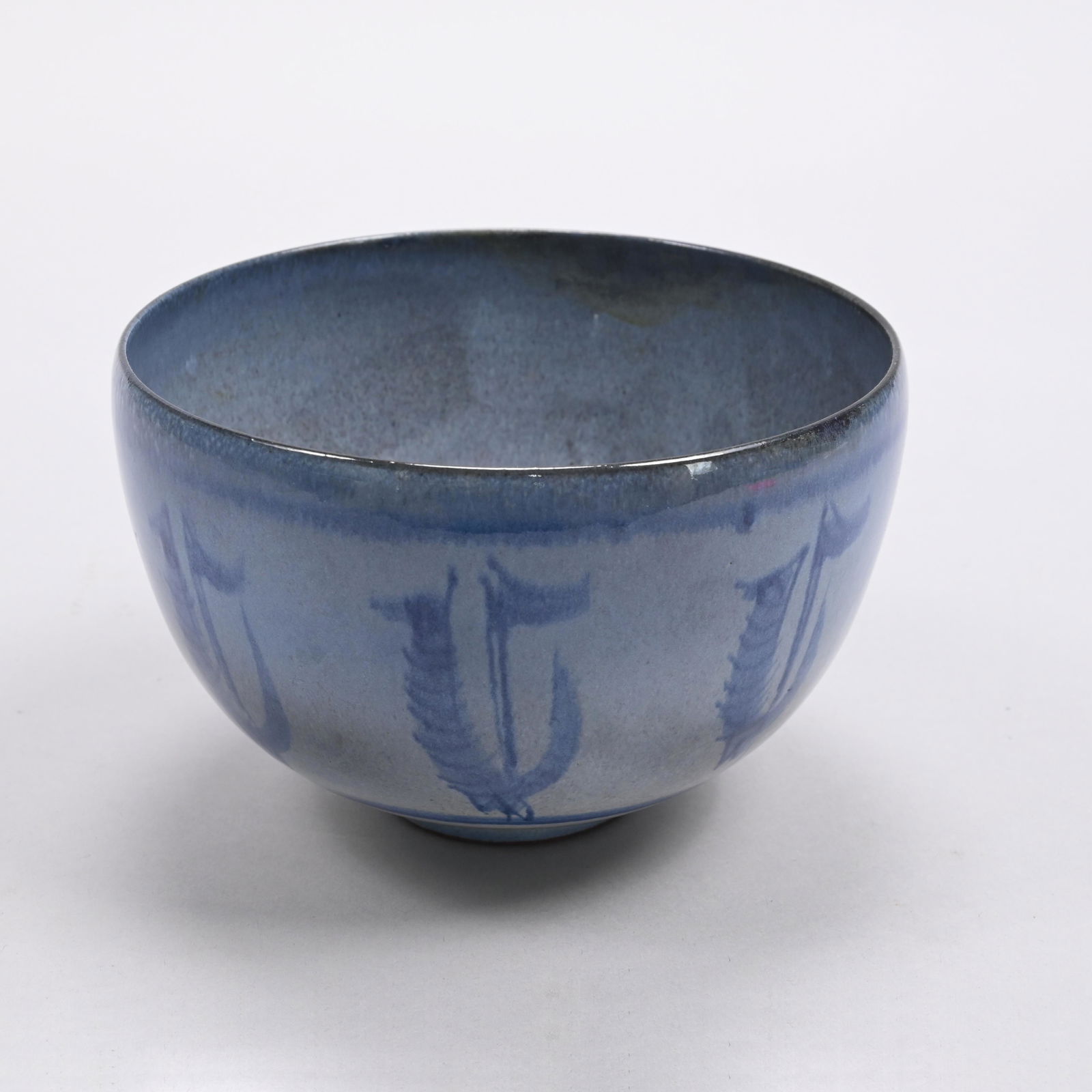 Edwin & Mary Scheier Glazed Pottery Bowl, 1960's: Edwin O. Scheier (1910-2008) and Mary Goldsmith Scheier (1908-2007), Durham, New Hampshire, 1960s. The sides surrounded by feathered U's centering flags, covered in shades of blue glaze, incised "Sche