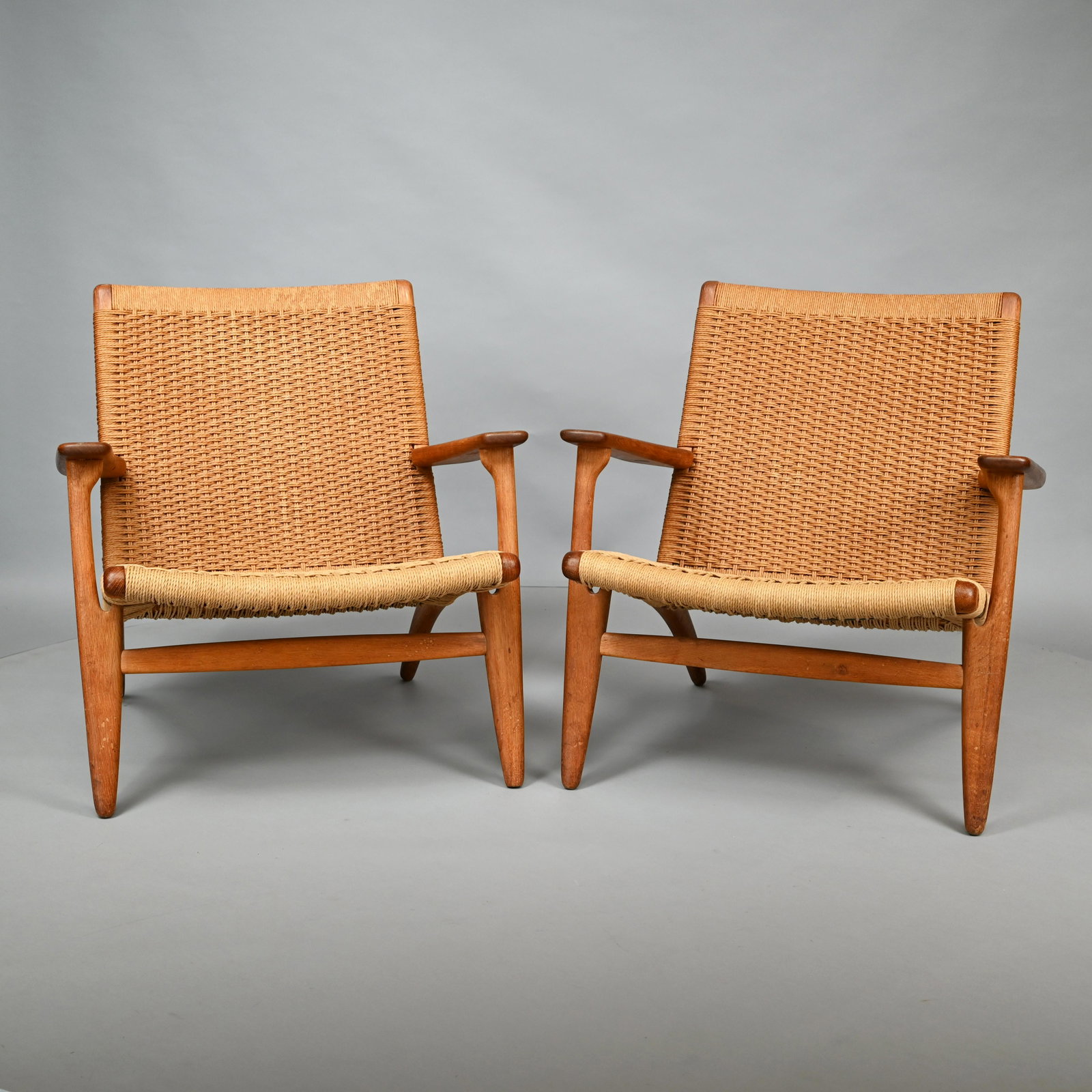 Pair of Hans J. Wegner Teak Lounge Chairs, 1950's: Model CH25. H: 27.5 in., W: 27.5 in., D: 28.75 in.
