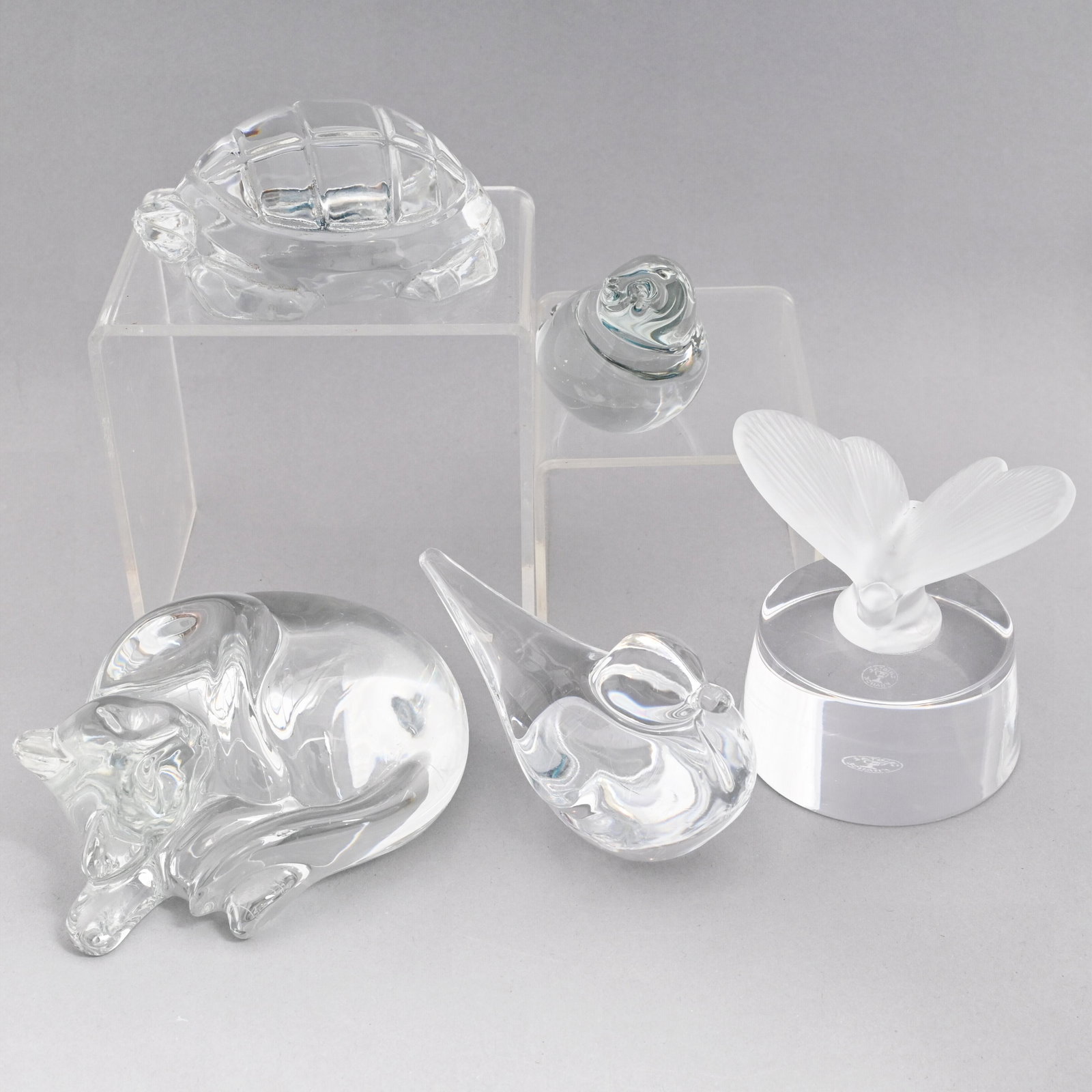 Five French Glass Hand Coolers/ Paperweights: Comprising a sleeping cat, a turtle and a satin and colorless glass butterfly, all Baccarat, the cat etched "Baccarat" in script, the turtle and butterfly each etched with the "BACCARAT FRANCE" circul