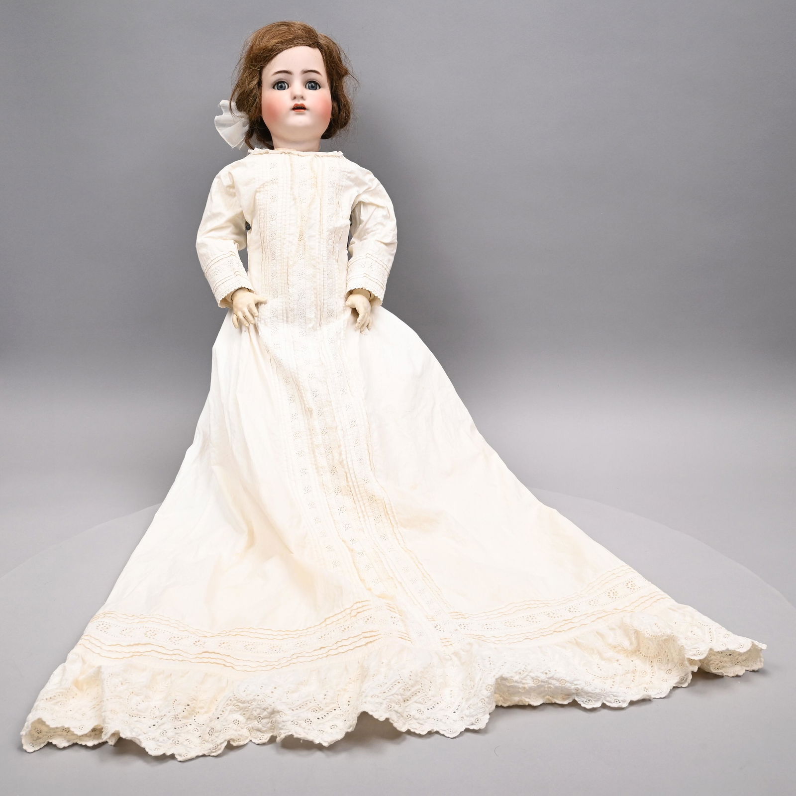 German Doll,Simon Halbig/ Kammer Reinhardt,1902-20: German Bisque Porcelain Doll, the Head Modelled by Kammer & Reinhardt, the Body Simon & Halbig, 1902-20. The bisque socket head with blue sleep eyes, painted lashes and applied upper lashes, molded an