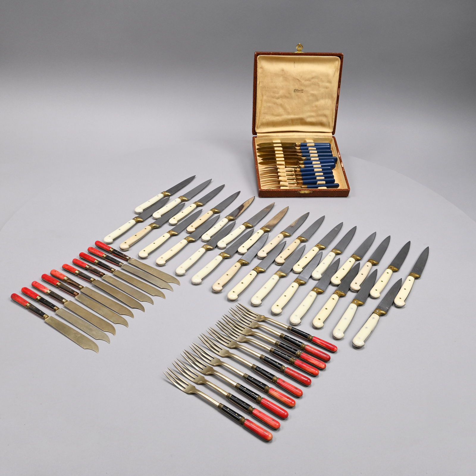 French Gilt-Brass & Bakelite Fruit Set & 2 Others: French Gilt-Brass Fruit Set, Retailed by B. Altman, Early Twentieth Century. Comprising six forks and six knives, each ferule embossed with a shell, each fork marked "B. ALTMAN & CO./ MADE IN FRANCE;"