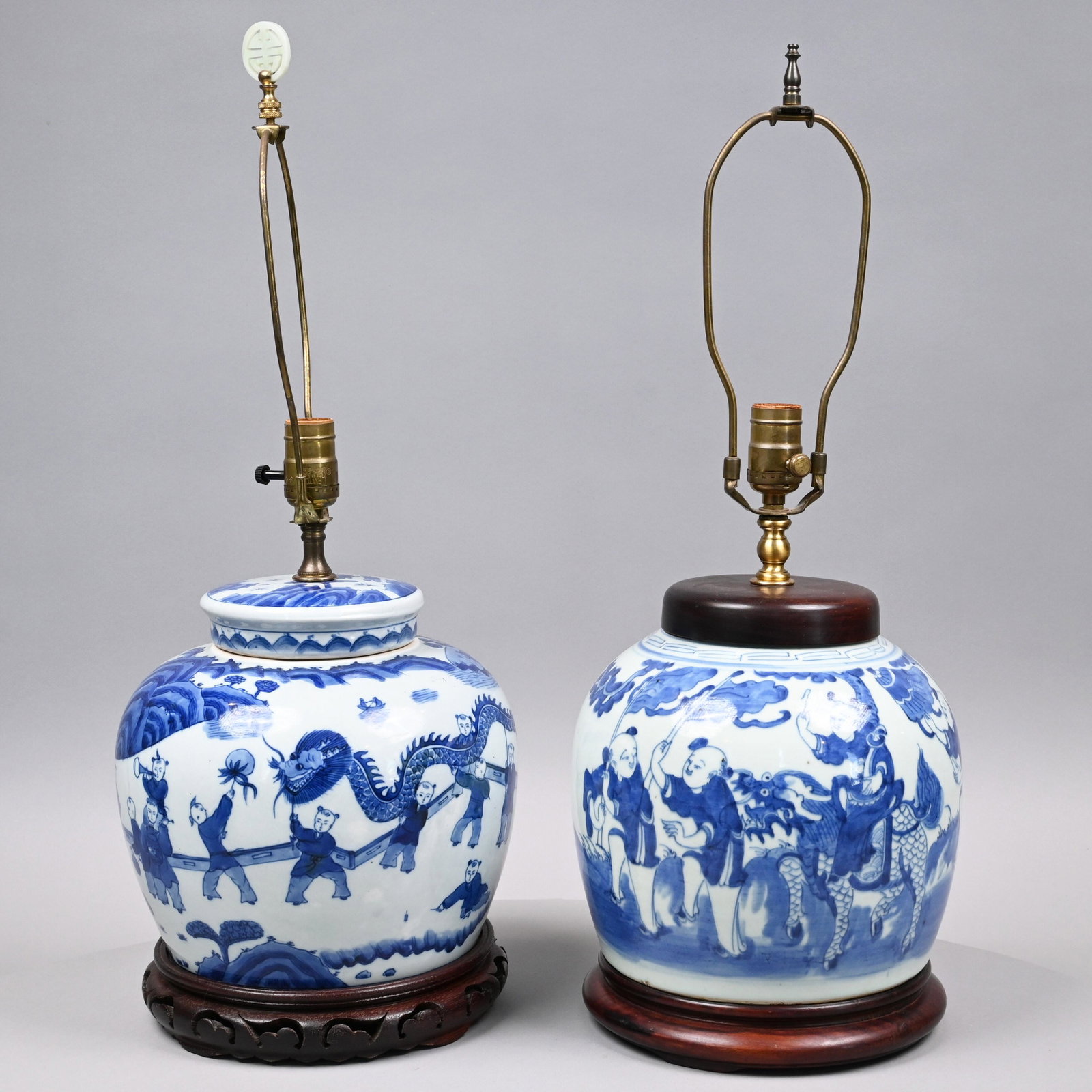 Two Chinese Export Porcelain Blue & White Vases: Late Nineteenth-Early Twentieth Century. The first painted with a continuous view of boys participating in a Dragon Lantern Dance, the back with a distant small procession of boys and a pine tree, all