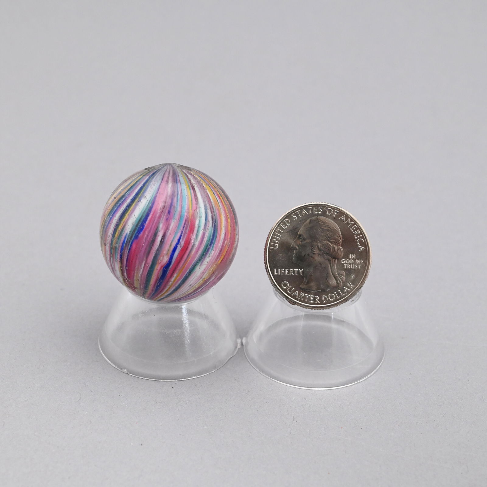 Multi-Colored Onion Skin Marble: Composed of blue, red, rose, yellow and white streaks. Diameter: 1 7/32 in.