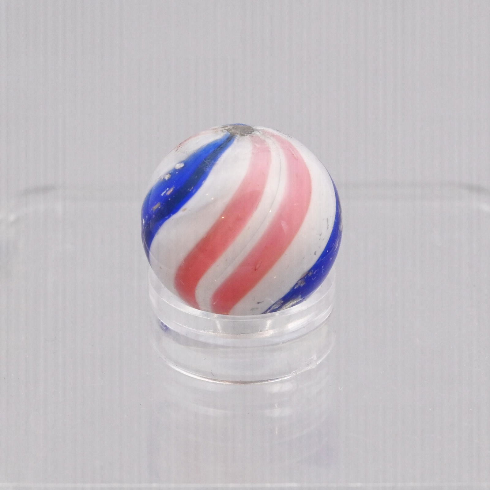 Peppermint Swirl with Mica Marble: In red, white and blue with flecks of mica in the blue bands. Diam: 85/128 in.