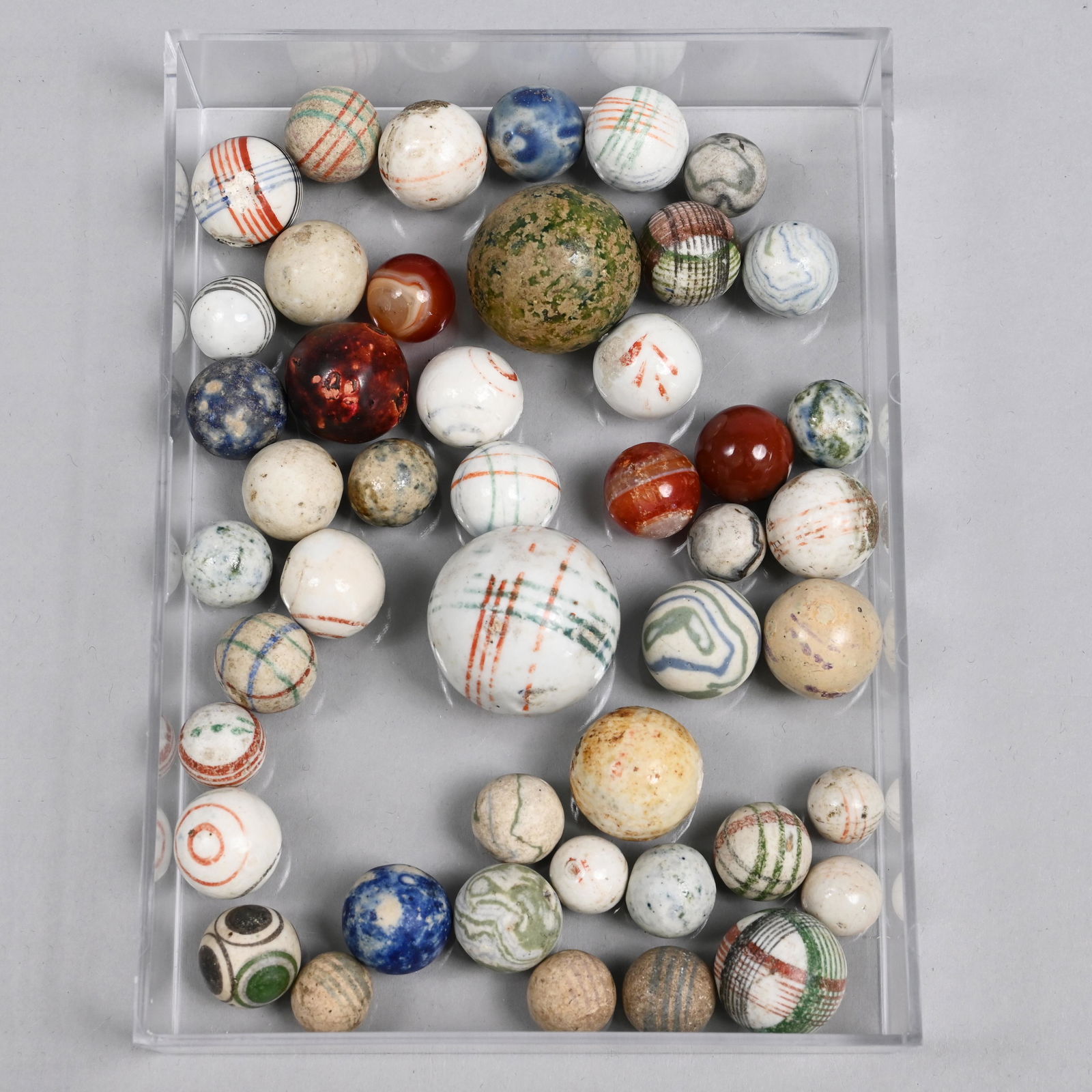 Group of China, Glazed China and Jasper Marbles: Approximate range of diam: 35/64 to 1 23/64 in.