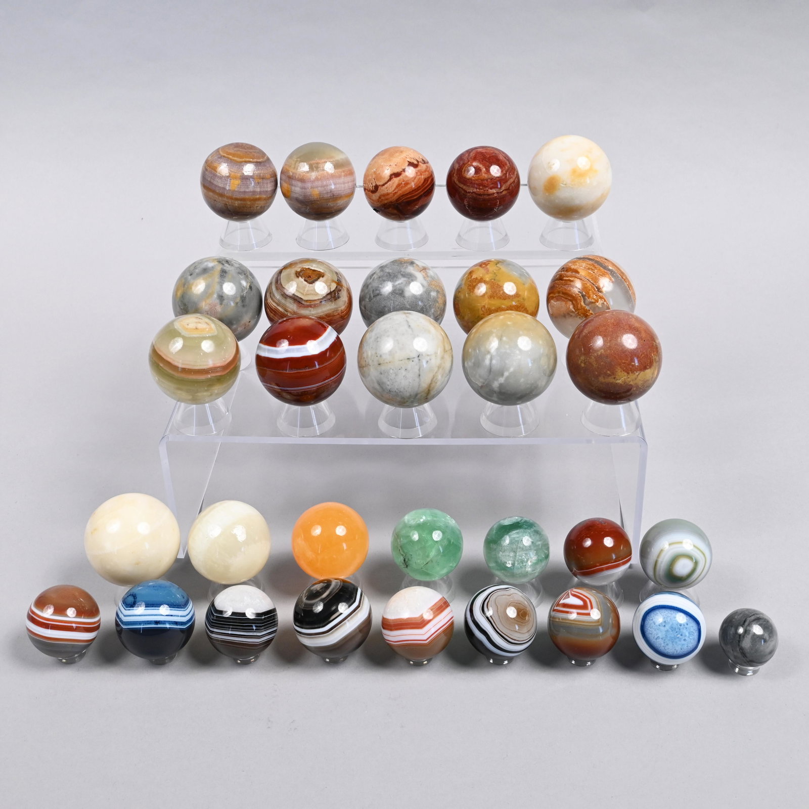 Thirty-One Contemporary Assorted Agate Marbles: Approximate range of diam: 1 23/128 to 2 9/128 in.