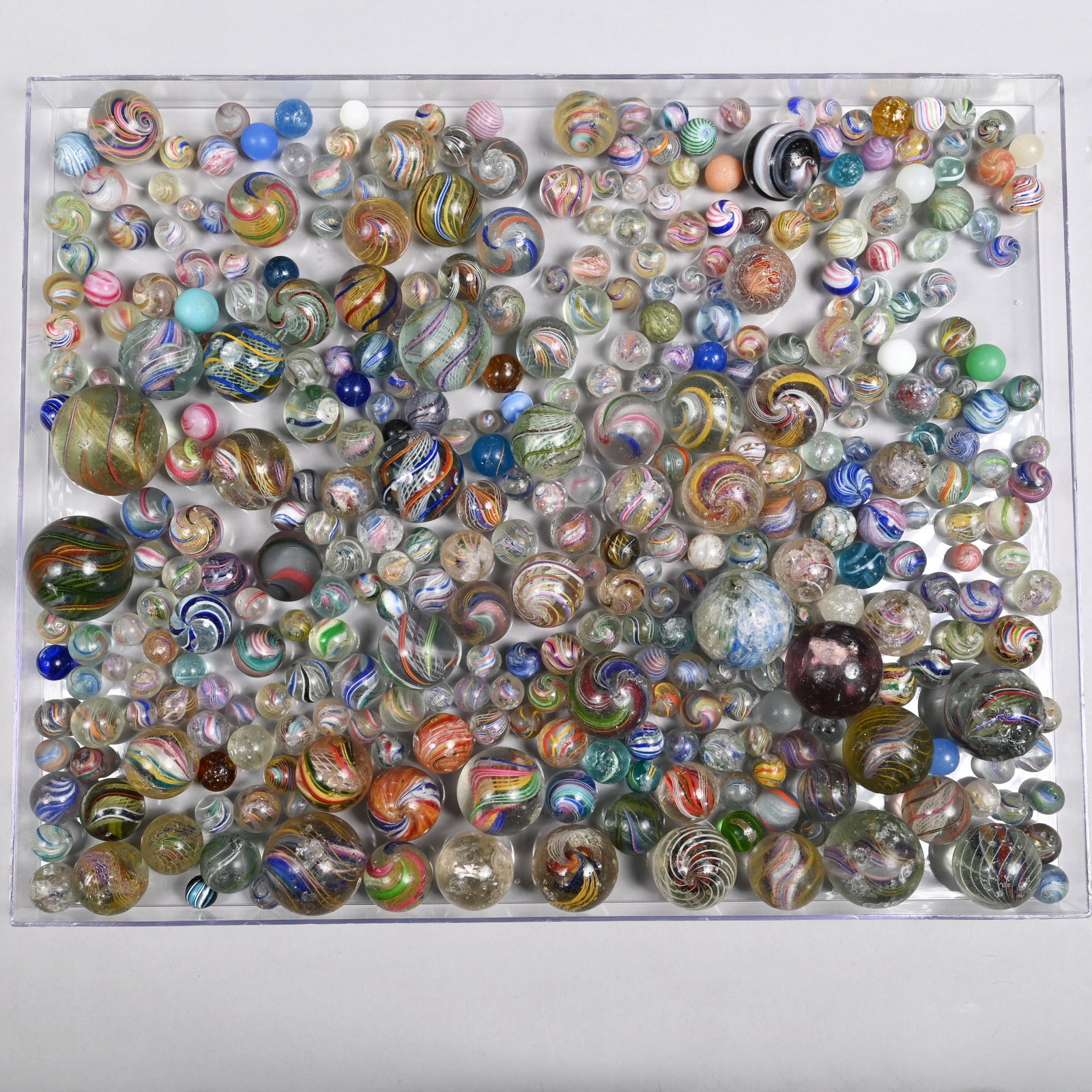 Large Group of Handmade Marbles (As is): Including swirls, onion skins, opaques, agates and sulphides. Approximate range of diam: 29/64 to 2 5/32 in.