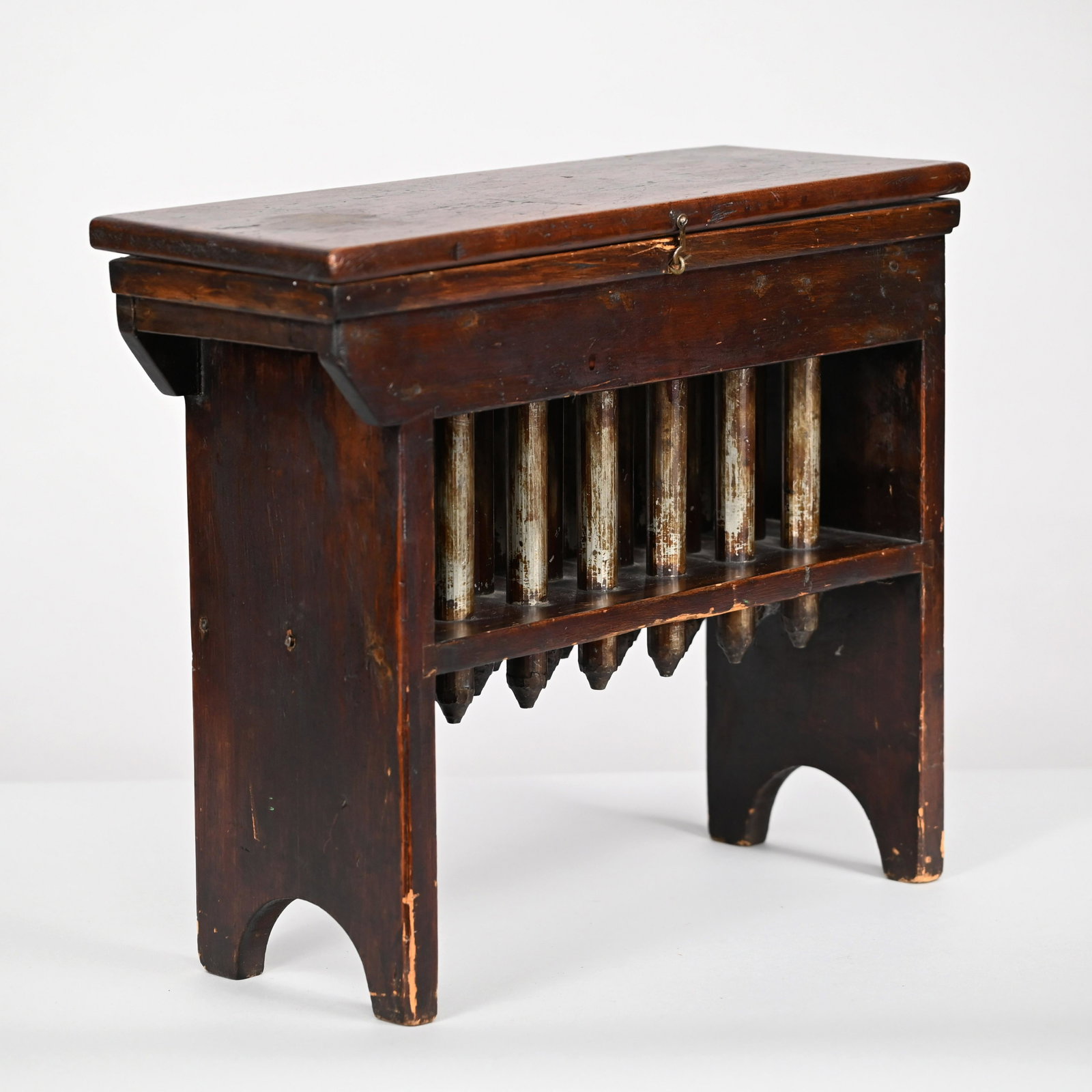 American Oak & Metal Eighteen Tube Box Candle Mold: Nineteenth Century. The rectangular top lifting above the interior fitted with eighteen apertures, the reeded molds continuing through a medial shelf, raised on arched side supports. H: 18 in., W: 21.